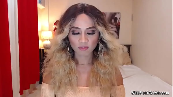 Shemale masturbates and cums in hand in front of webcam